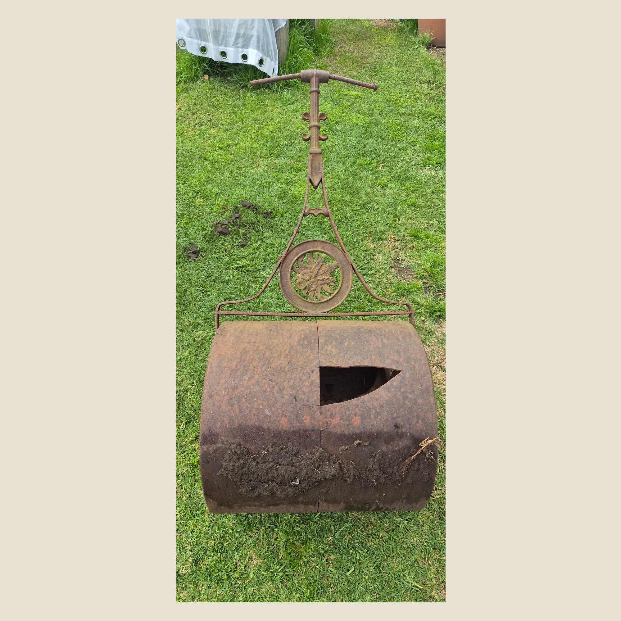 Antique cast iron garden roller with ornate floral handle, Victorian/Edwardian