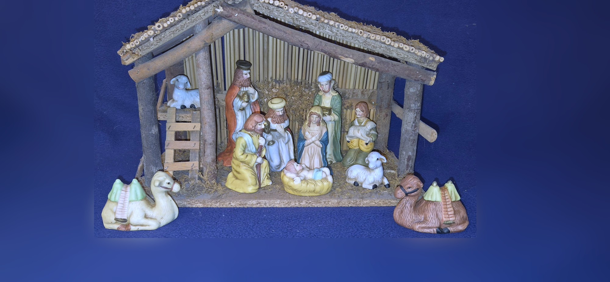 Porcelain nativity scene with timber stable
